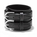 Load image into Gallery viewer, The cuff laid flat, showing the full width of the strap and both buckle straps