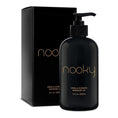 Load image into Gallery viewer, Nooky vanilla massage oil bottle on white