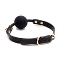 Load image into Gallery viewer, The strap closed in a loop showing the gold pin buckle, keeper and punched adjustment holes