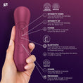 Cargar la imagen en la vista de la galería, The wine red stimulator held in a hand with every button and the Bluetooth pairing labelled