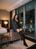 Cargar la imagen en la vista de la galería, Black garter stockings in a hotel room with a satin camisole and shorts, straps drawn up