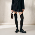 Cargar la imagen en la vista de la galería, Black garter thigh high stockings worn under a pleated skirt with loafers, all four straps visible