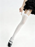 Cargar la imagen en la vista de la galería, White thigh high stocking extended, showing the top band and strap
