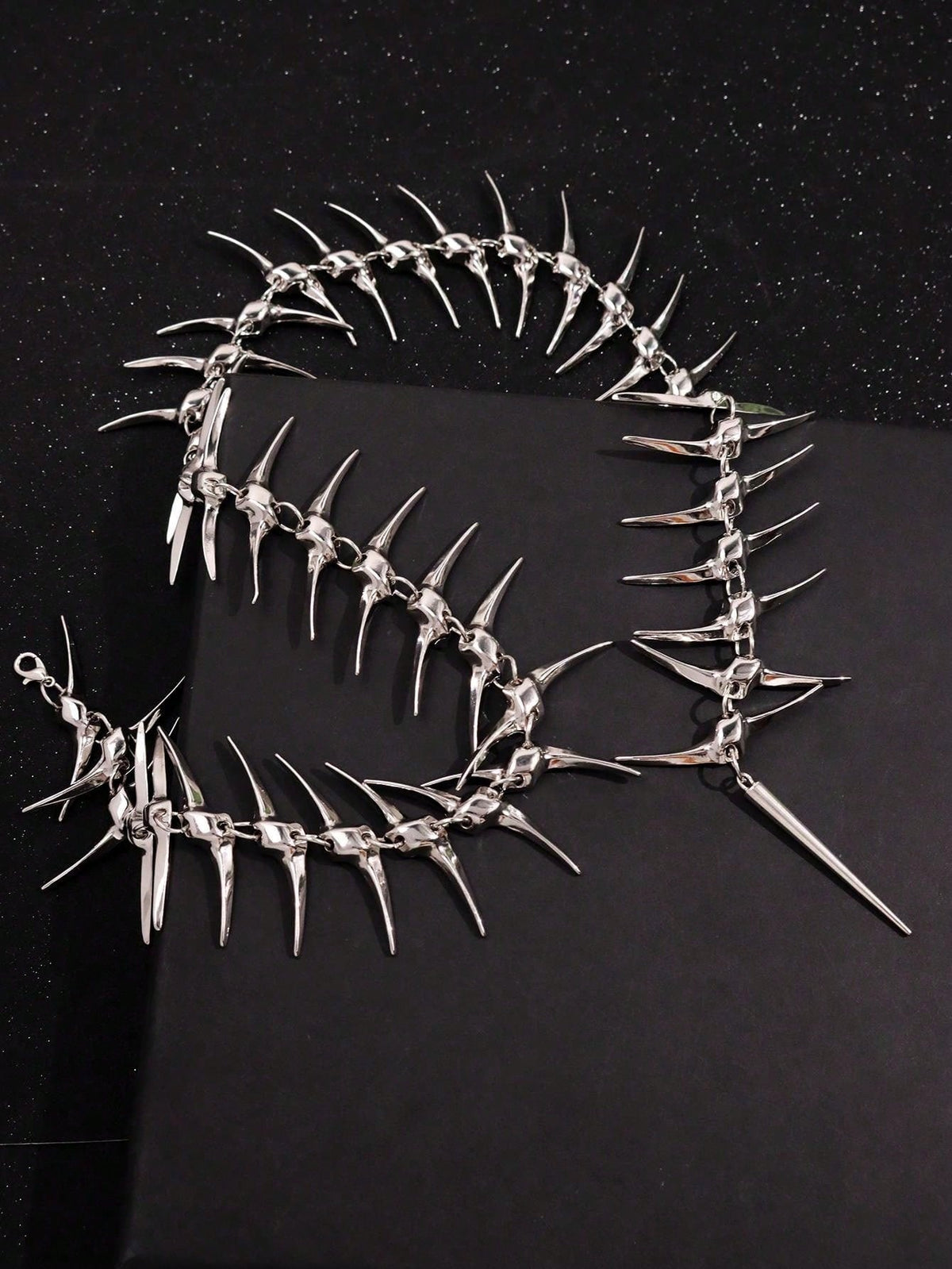 The full spiked spine necklace laid flat, collar and back drop