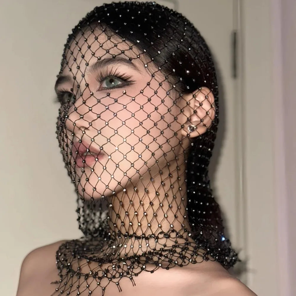 Black rhinestone net veil draped across the face, side view