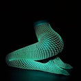 Load image into Gallery viewer, The tights glowing green against a dark background
