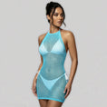 Cargar la imagen en la vista de la galería, Aqua fishnet halter mini cover-up dress, three-quarter front view on a model
