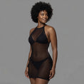 Cargar la imagen en la vista de la galería, Three-quarter side view of the black see-through fishnet mini cover-up dress
