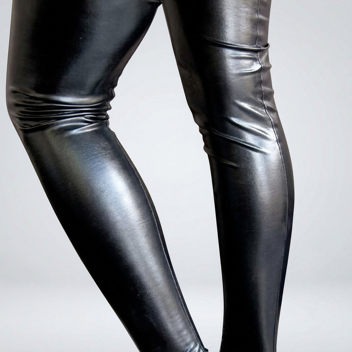 Close-up of the high-shine wet-look finish and the seam running down the calf