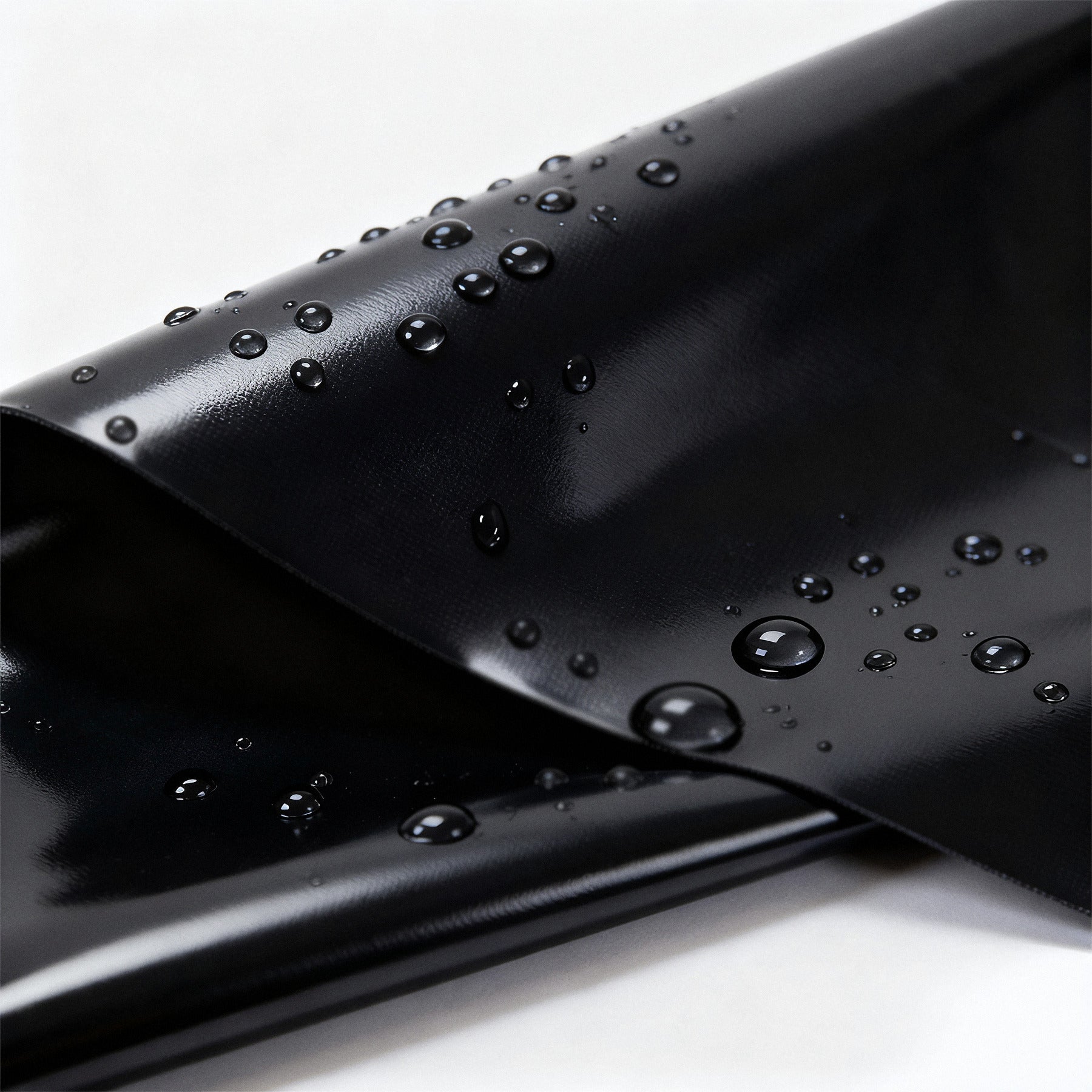 Water beading on the surface of the PVC sheet, nothing soaking in