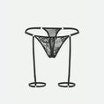 Load image into Gallery viewer, Black floral lace G-string with harness straps and leg loops, front view
