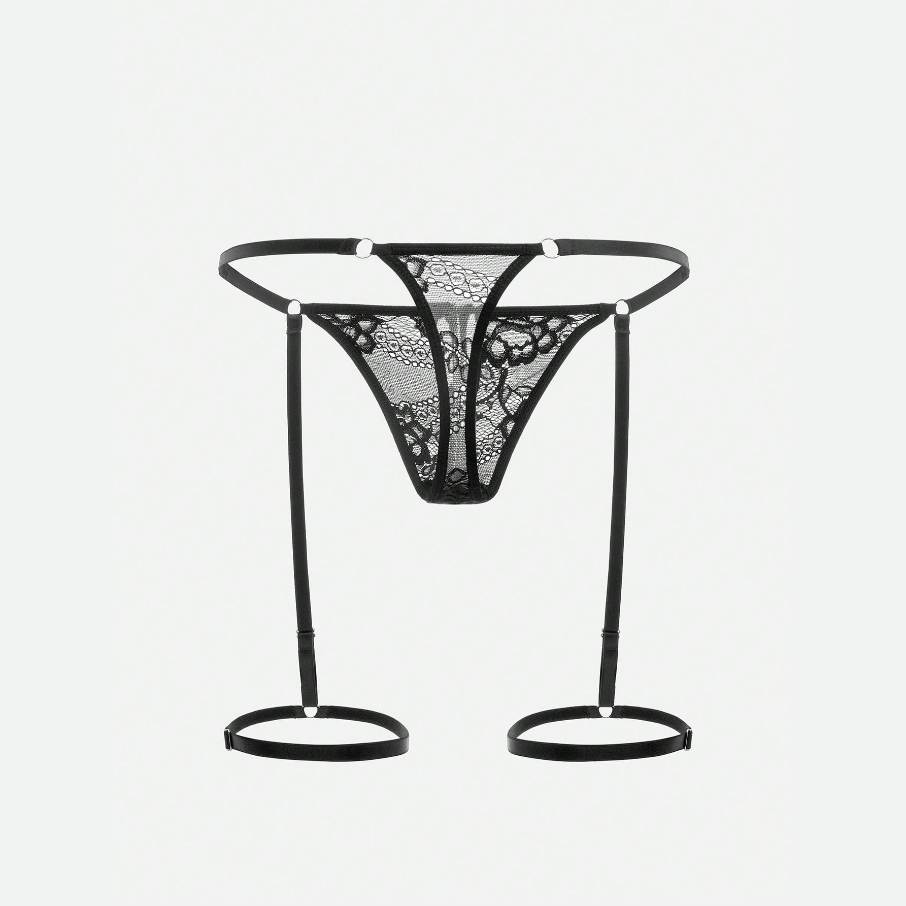 Lace G-string harness laid flat showing the full strap layout