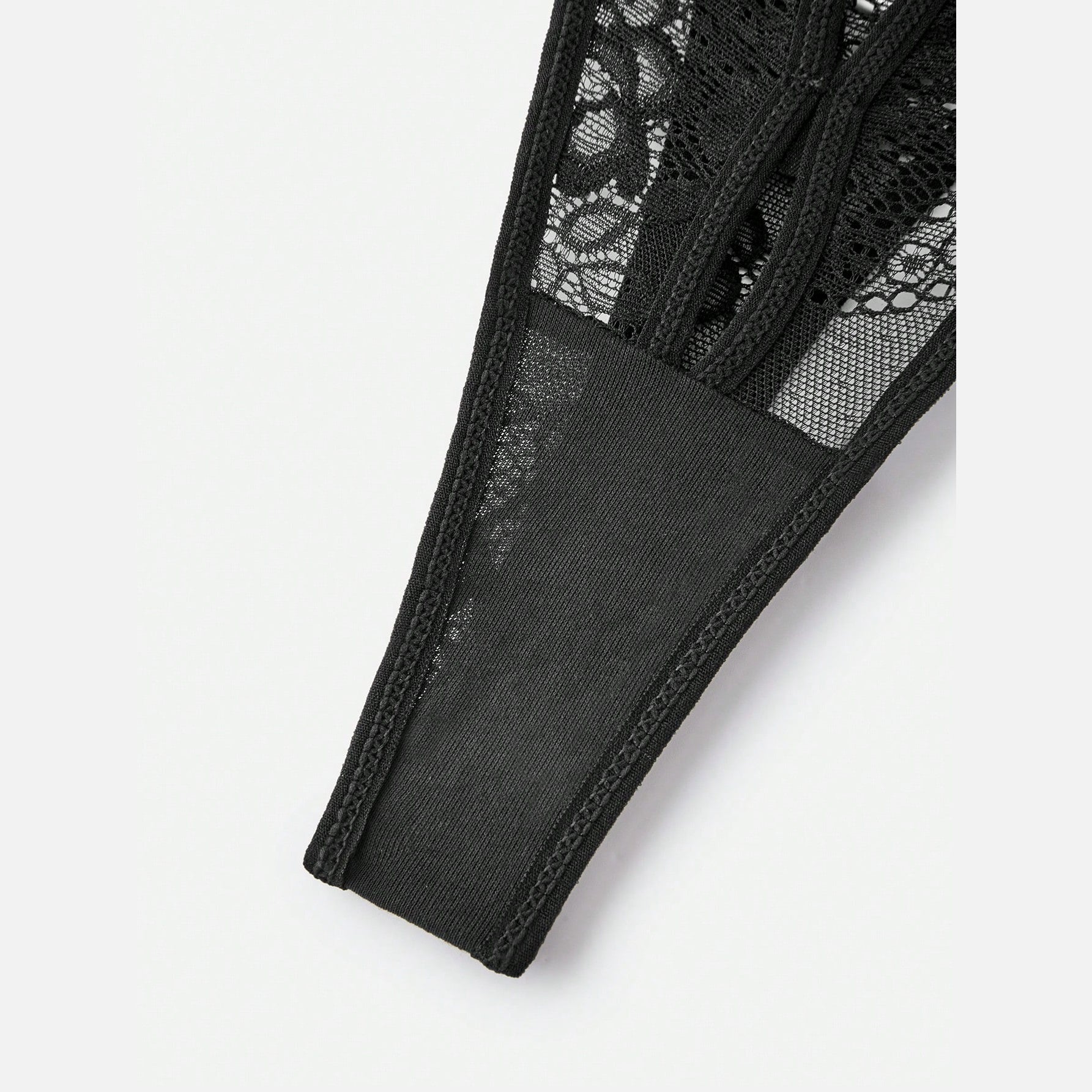 Close up of the semi-sheer floral lace panel
