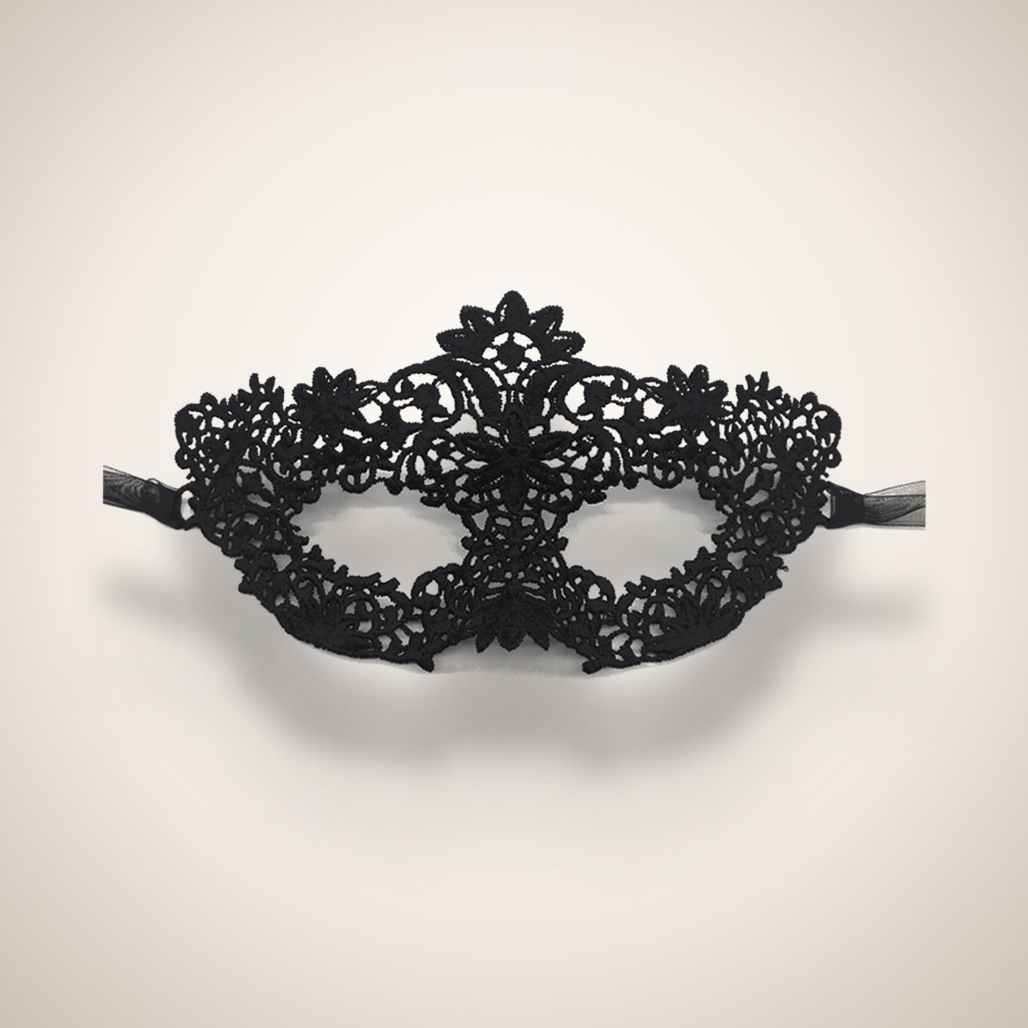 Black filigree lace masquerade mask, studio product shot