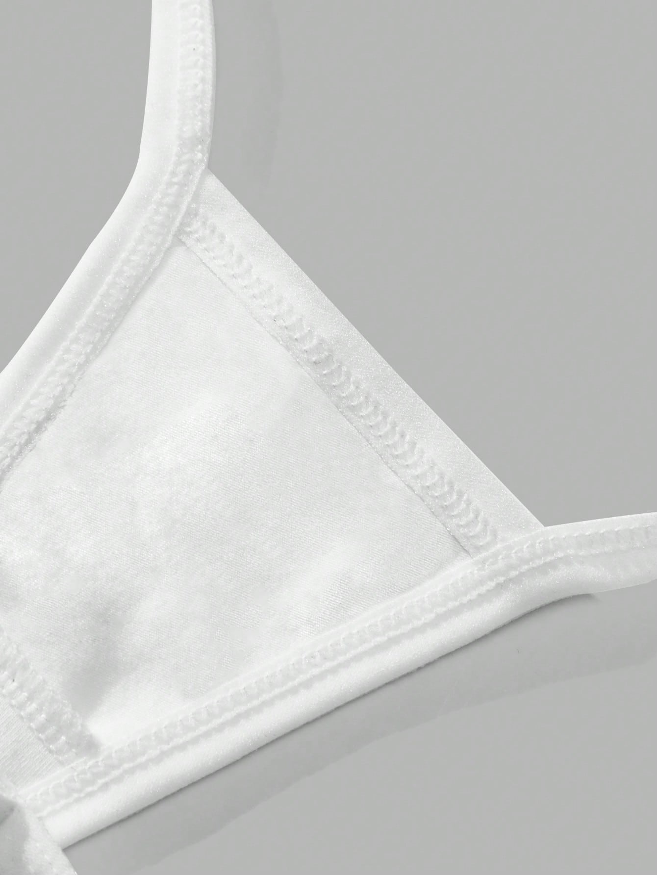 White cotton G-string showing the strap and front panel construction