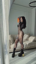 Reproducir el video en la vista de la galería, The bodystocking worn with boots, showing the ankle-length leg
