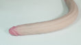 Load and play video in Gallery viewer, Studio footage of the 19.7 inch double-ended dildo: a head close-up, a twist, a bend and the seam in the middle

