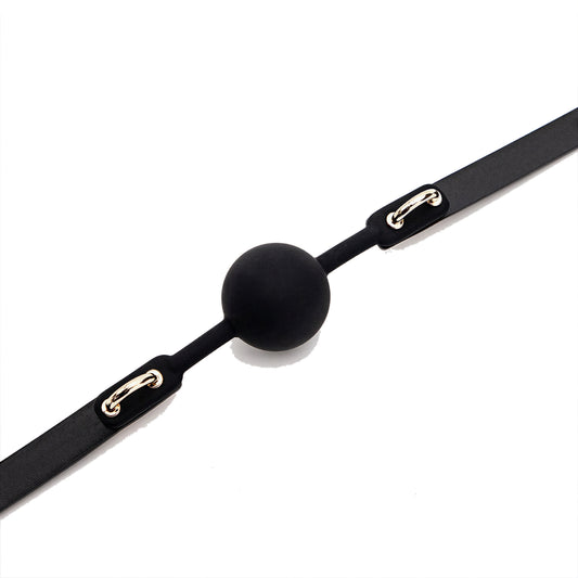 Close view of the solid silicone ball between the two moulded tabs that carry the gold D-rings