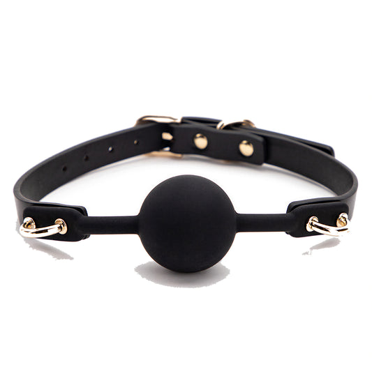 Black silicone ball gag on a slim black strap with gold pin buckle, gold D-rings and domed gold studs