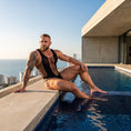 Cargar la imagen en la vista de la galería, Worn seated at a rooftop pool, showing how the net sits when the body bends
