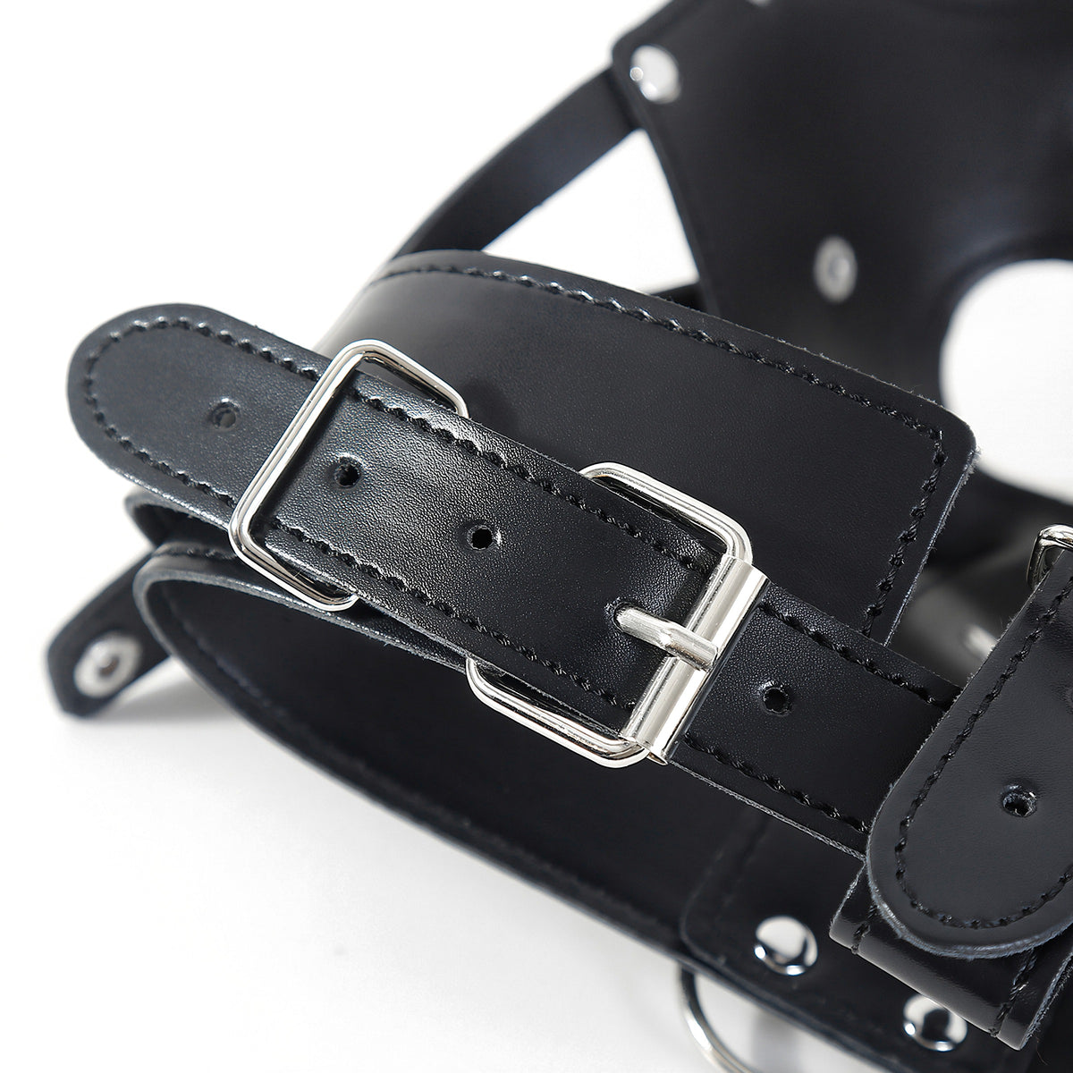 Close-up of the nickel-tone roller buckle, rivets and stitched edge