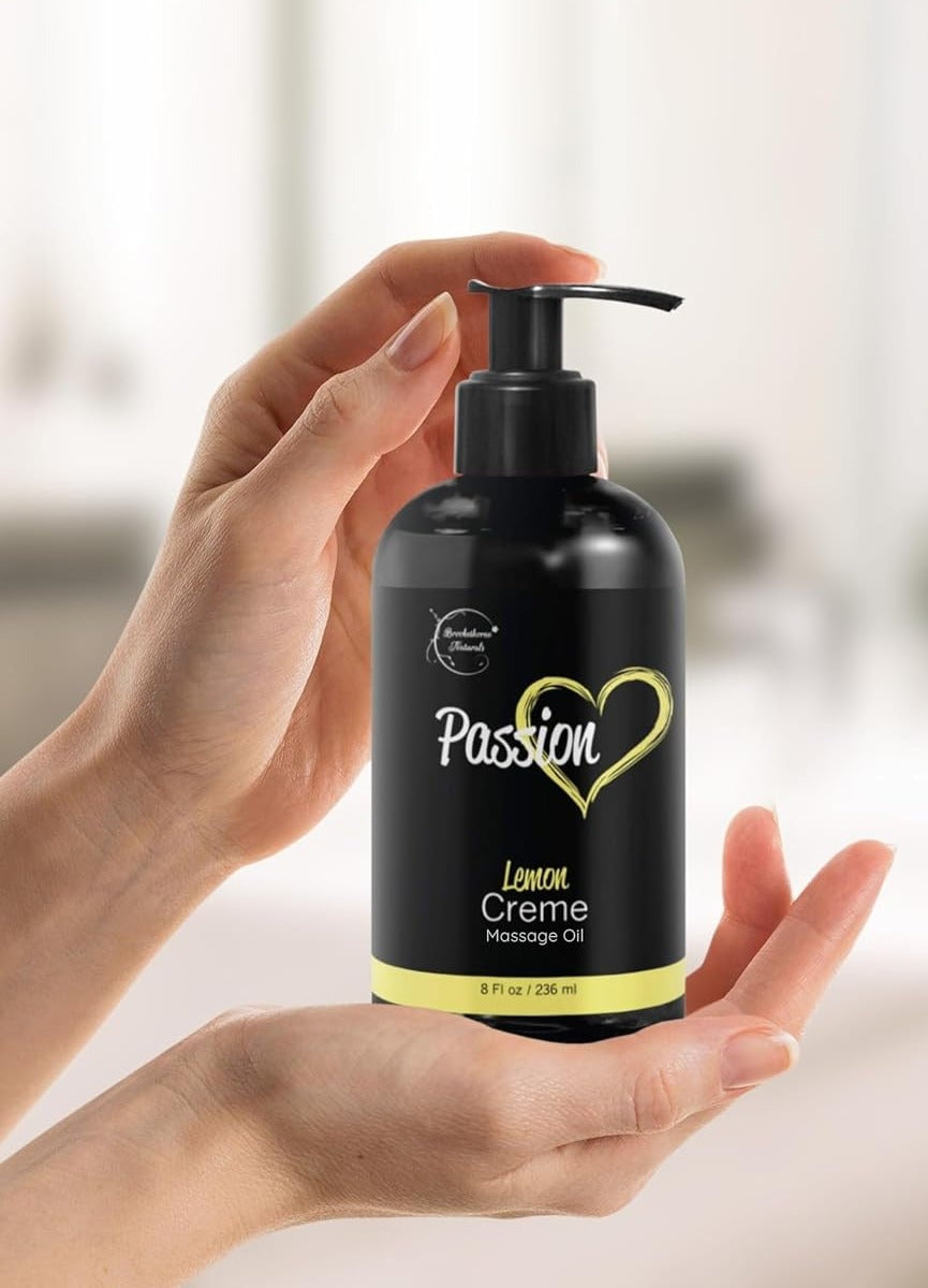 The 8 fl oz pump bottle held in two hands, showing its size