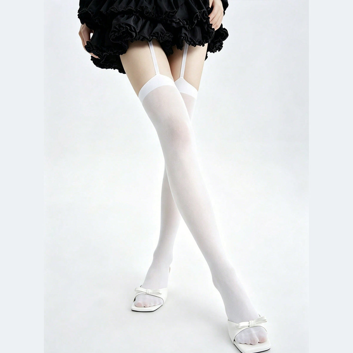 White garter thigh high stockings with attached straps, front view
