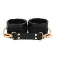 Cargar la imagen en la vista de la galería, Pair of plush-lined wrist cuffs with gold D-rings and connector strap
