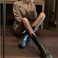 Cargar la imagen en la vista de la galería, XS grid fishnet tights worn seated with tall boots and a long coat
