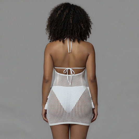 Back view of the white fishnet cover-up dress showing the low open scoop back
