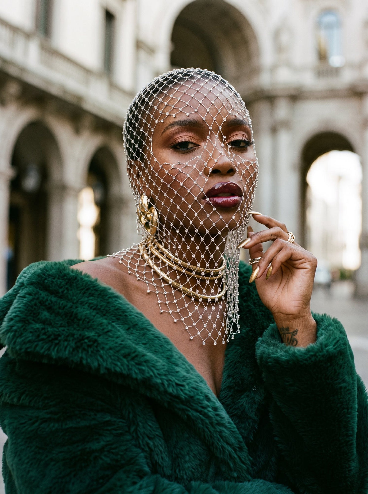 Pearl net veil read in open daylight on the street, worn with a faux-fur coat