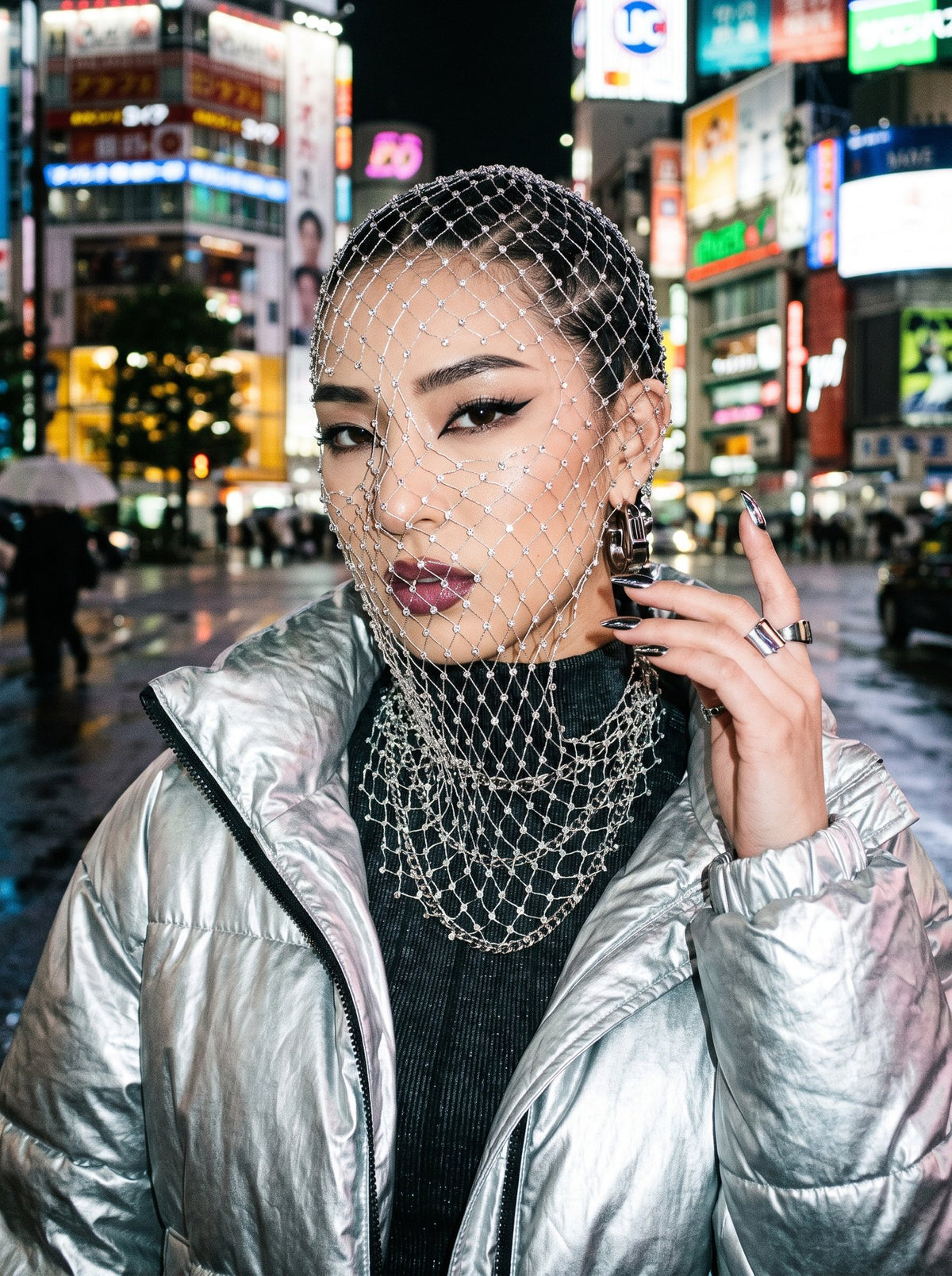 Pearl diamond-net veil on a rain-lit city street at night, worn over a high-neck top